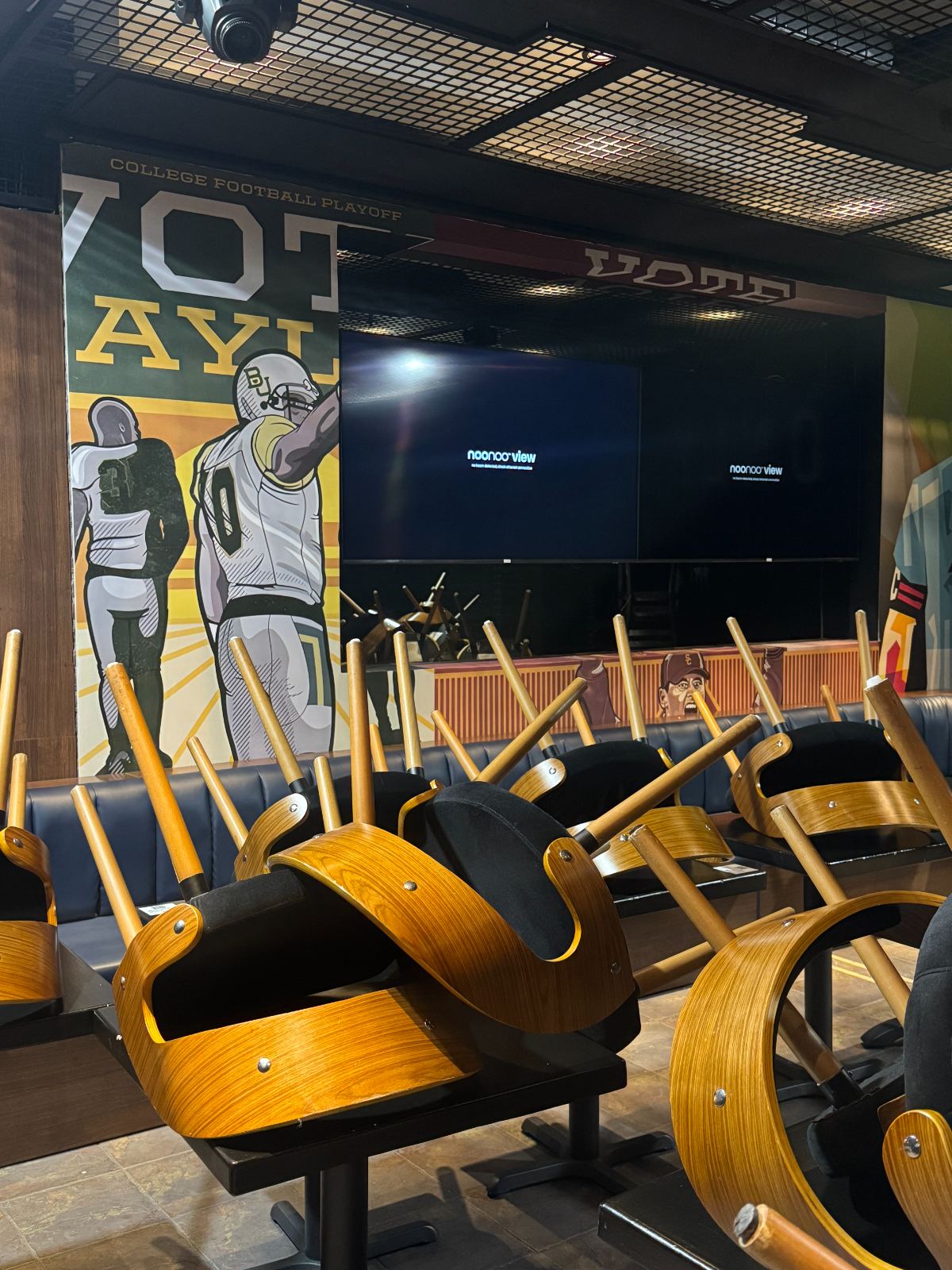 A fitness floor with a display over the equipment