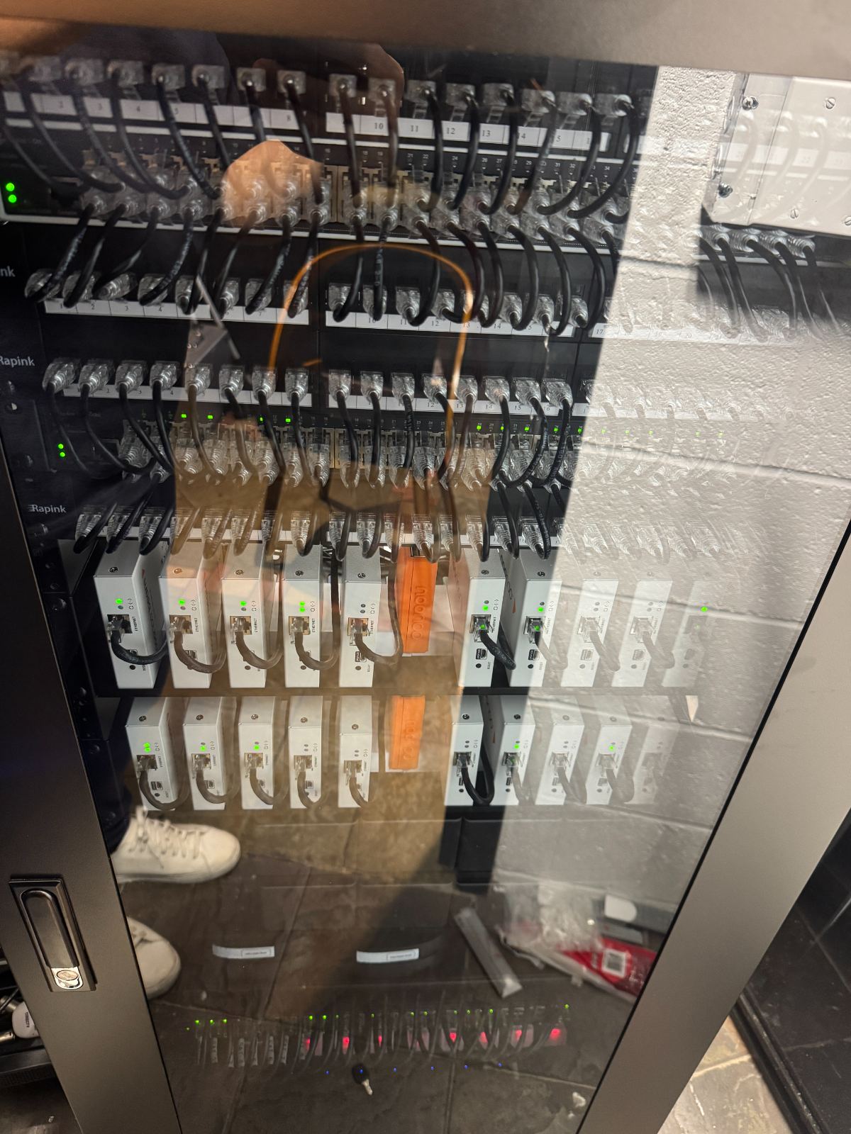 The rack behind its glass door in the finished room