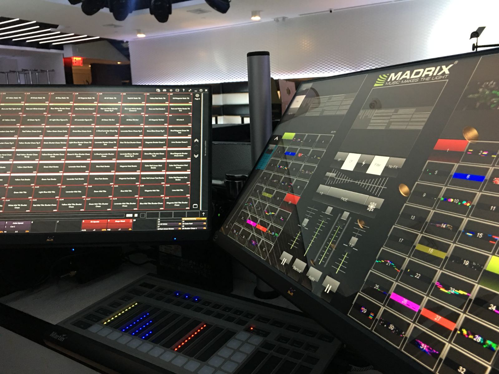 A lighting console and mixing desk at front of house