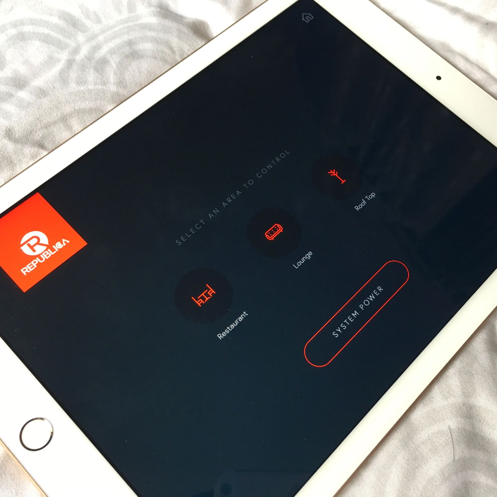 A tablet running the venue's control app