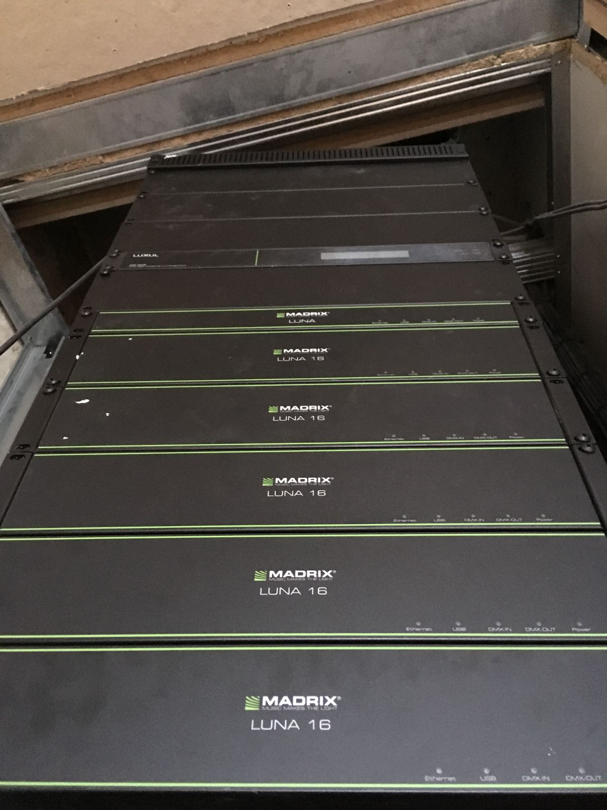 DMX lighting controllers stacked in the rack