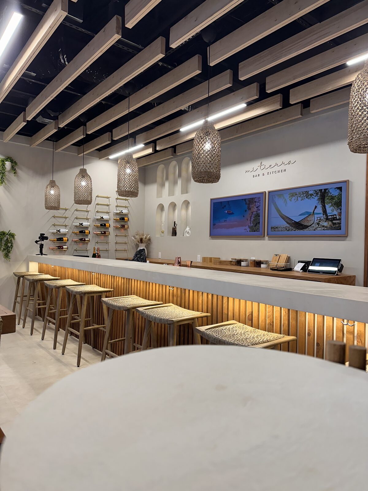 The bar and dining room, with framed displays above the back counter