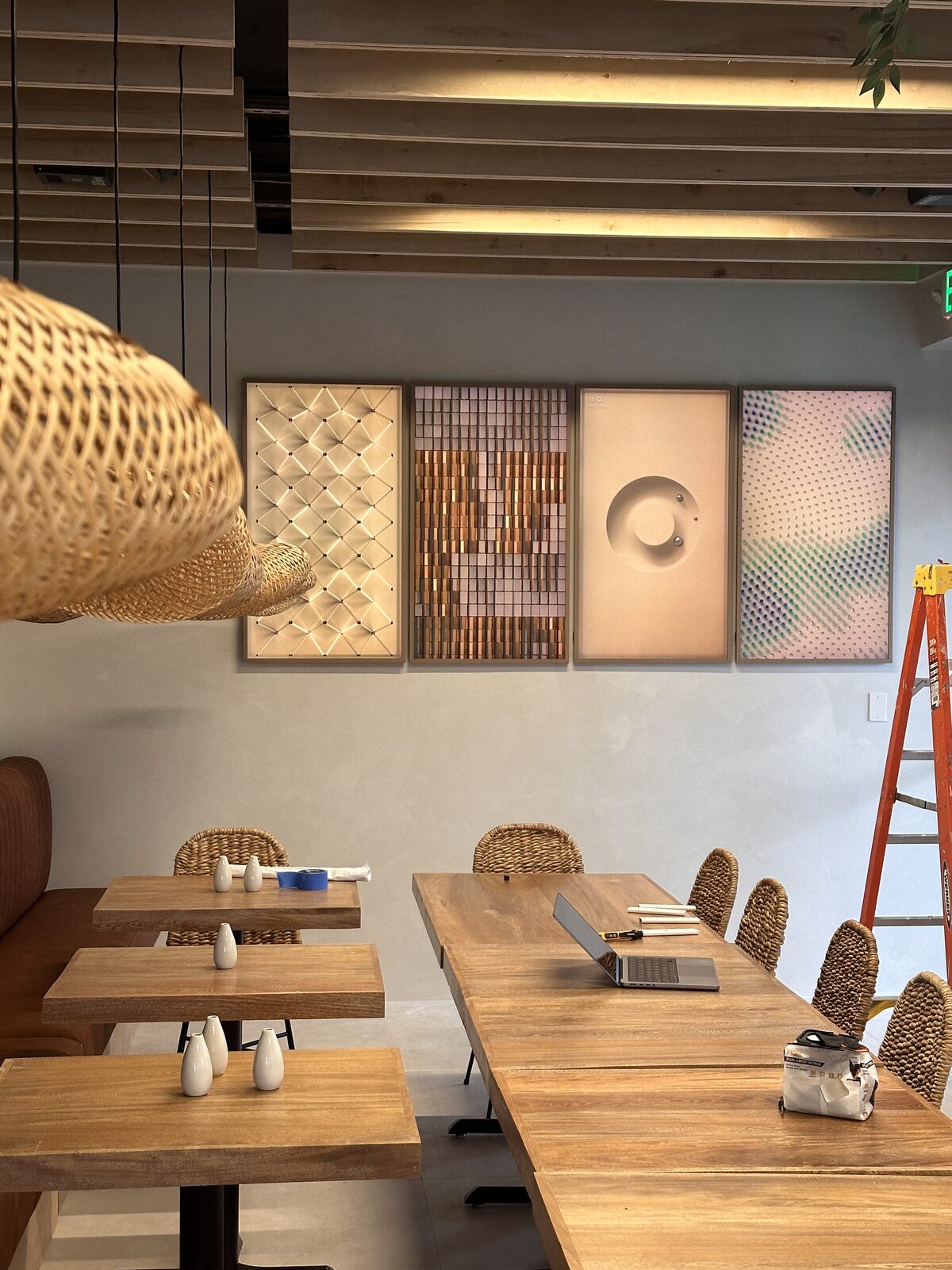 The dining room with its art wall and pendant lighting
