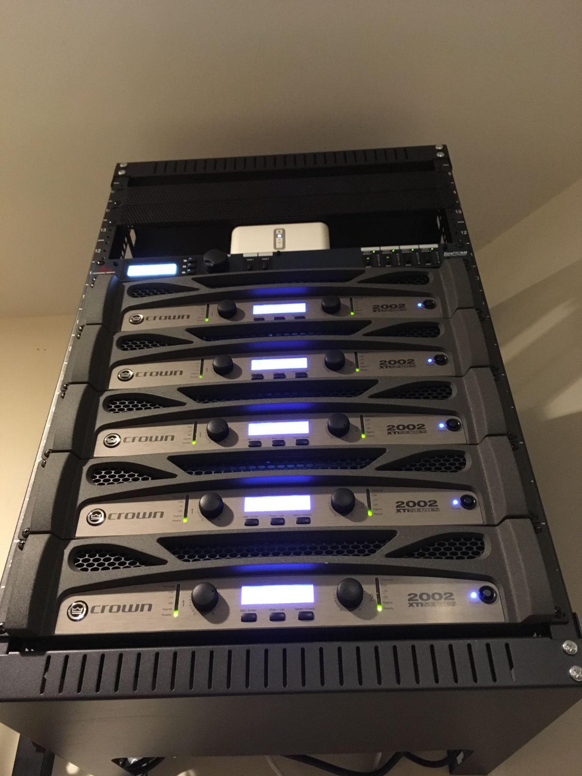 A rack of multichannel amplifiers driving the zones