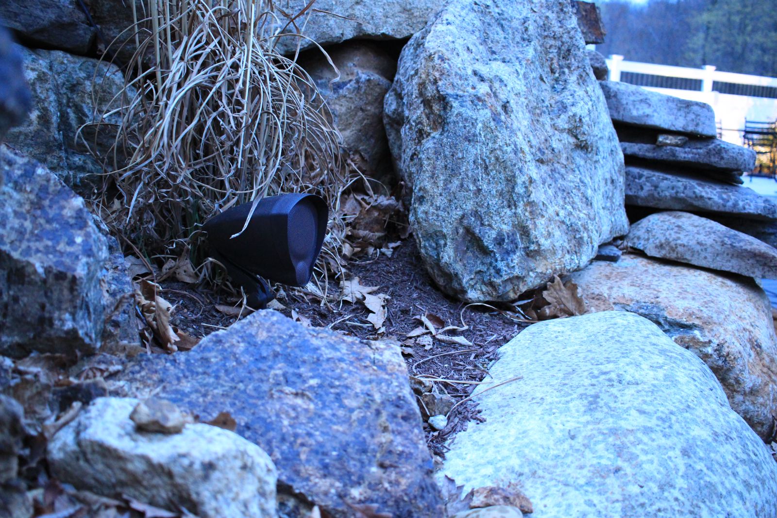 A rock speaker set among boulders