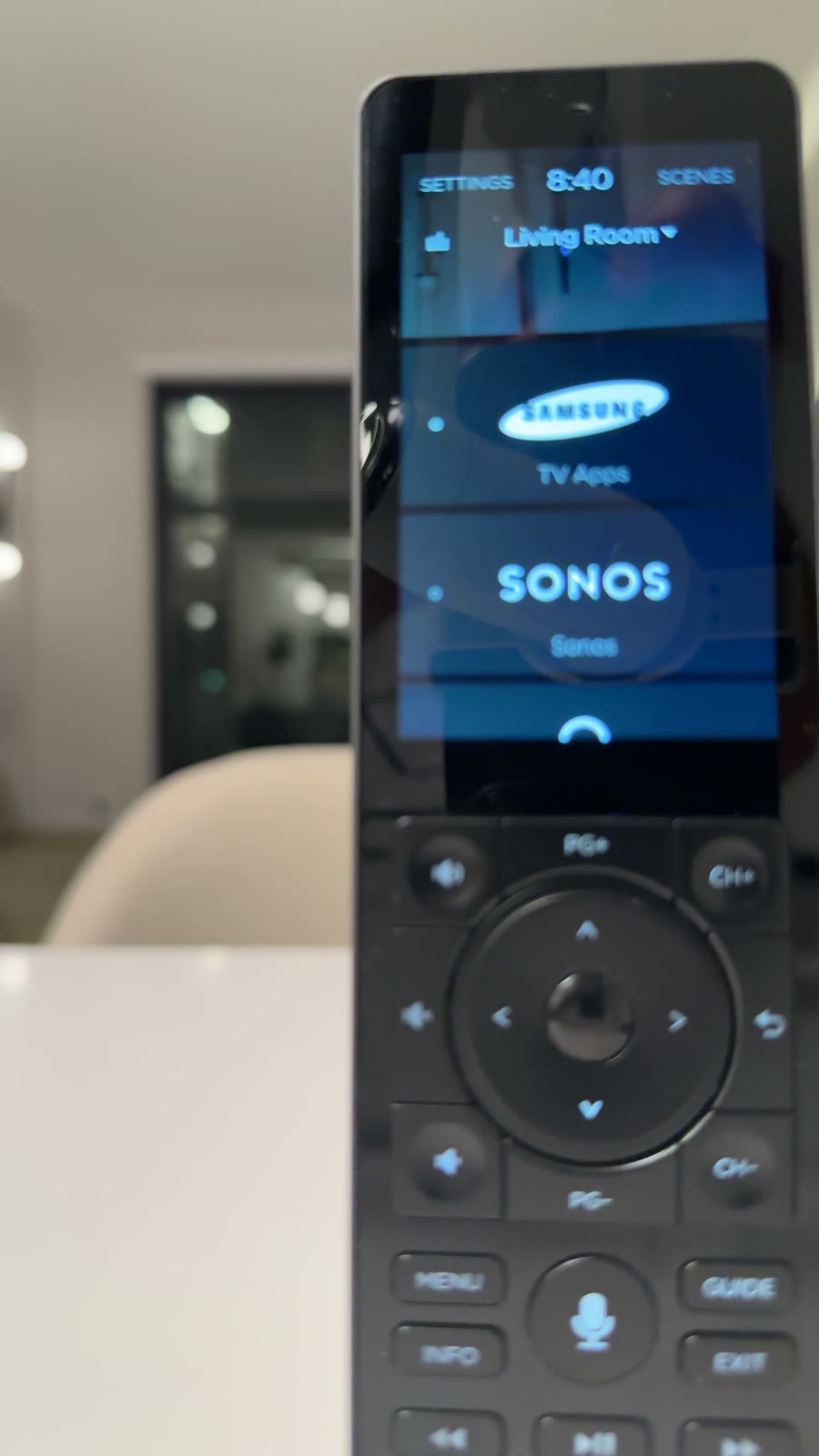 The Savant remote's screen showing the living room's sources, including Sonos