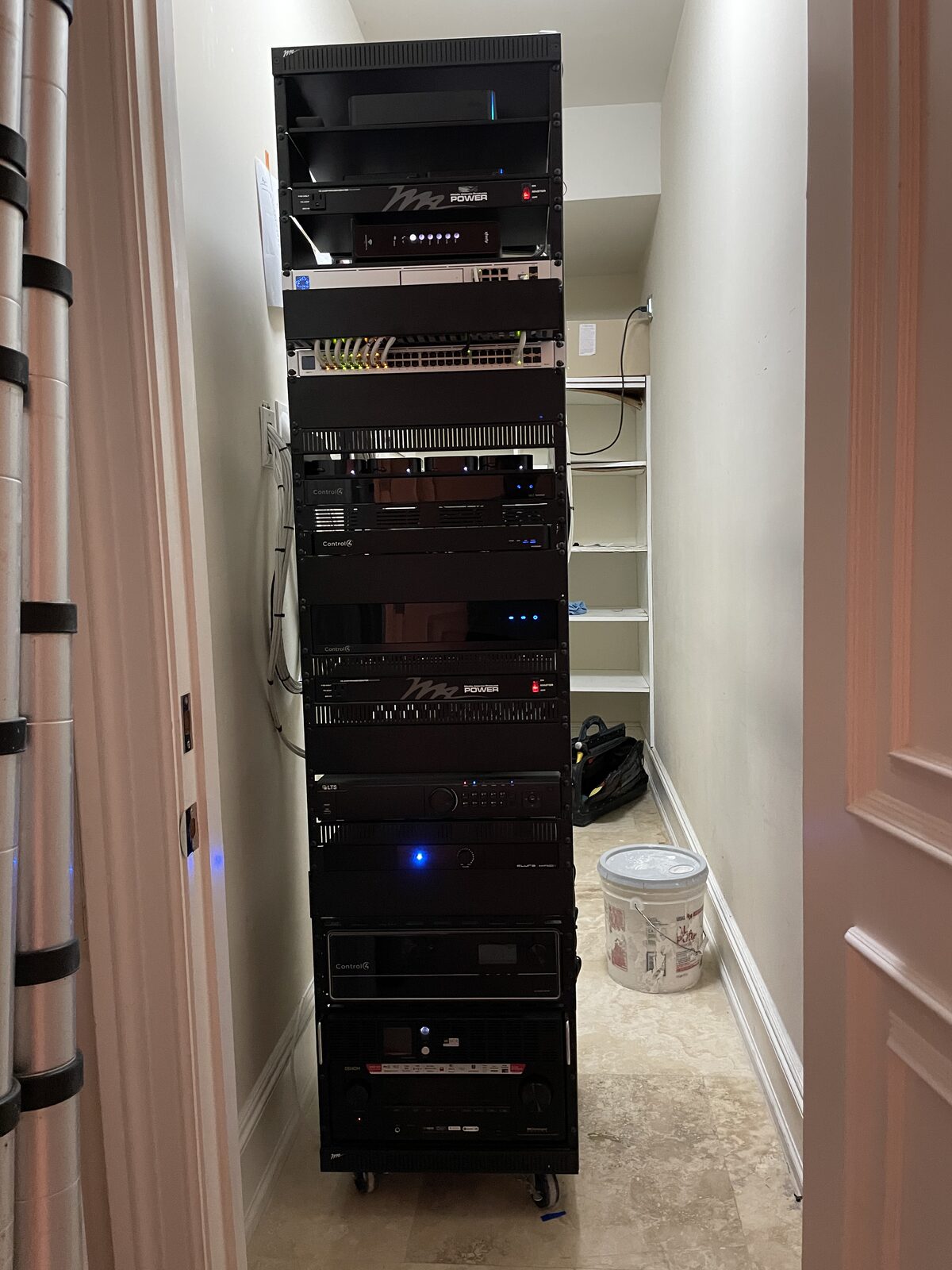 The house rack in its closet, lit from within