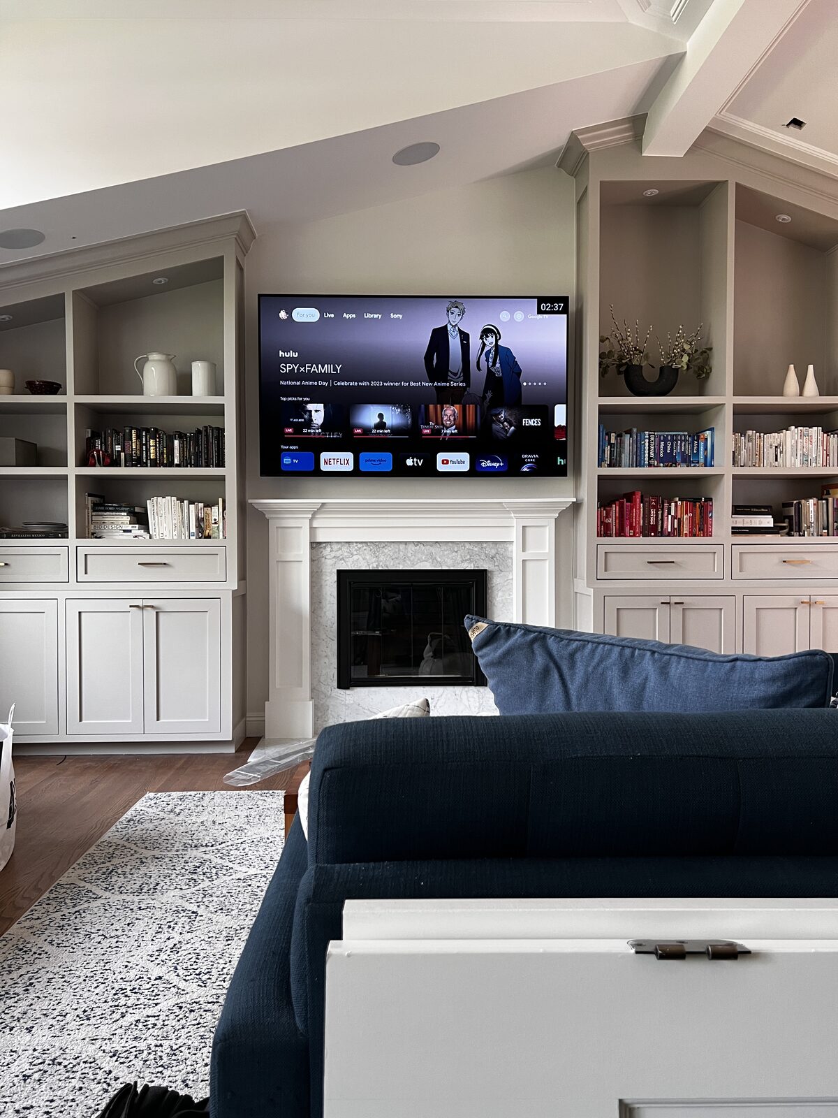 The finished room — display over the fireplace between built-ins